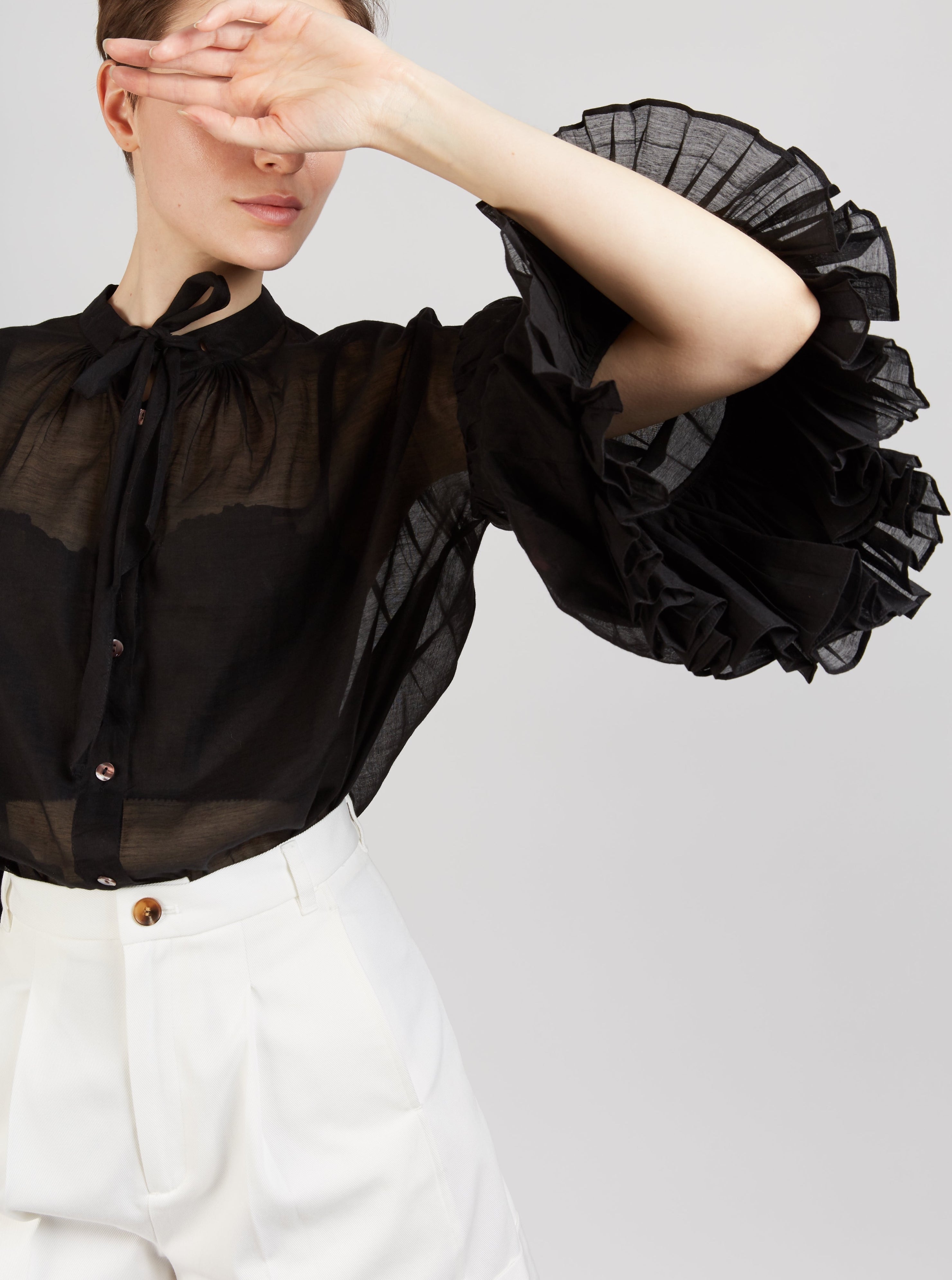 Front view of Rayne black blouse by Thierry Colson