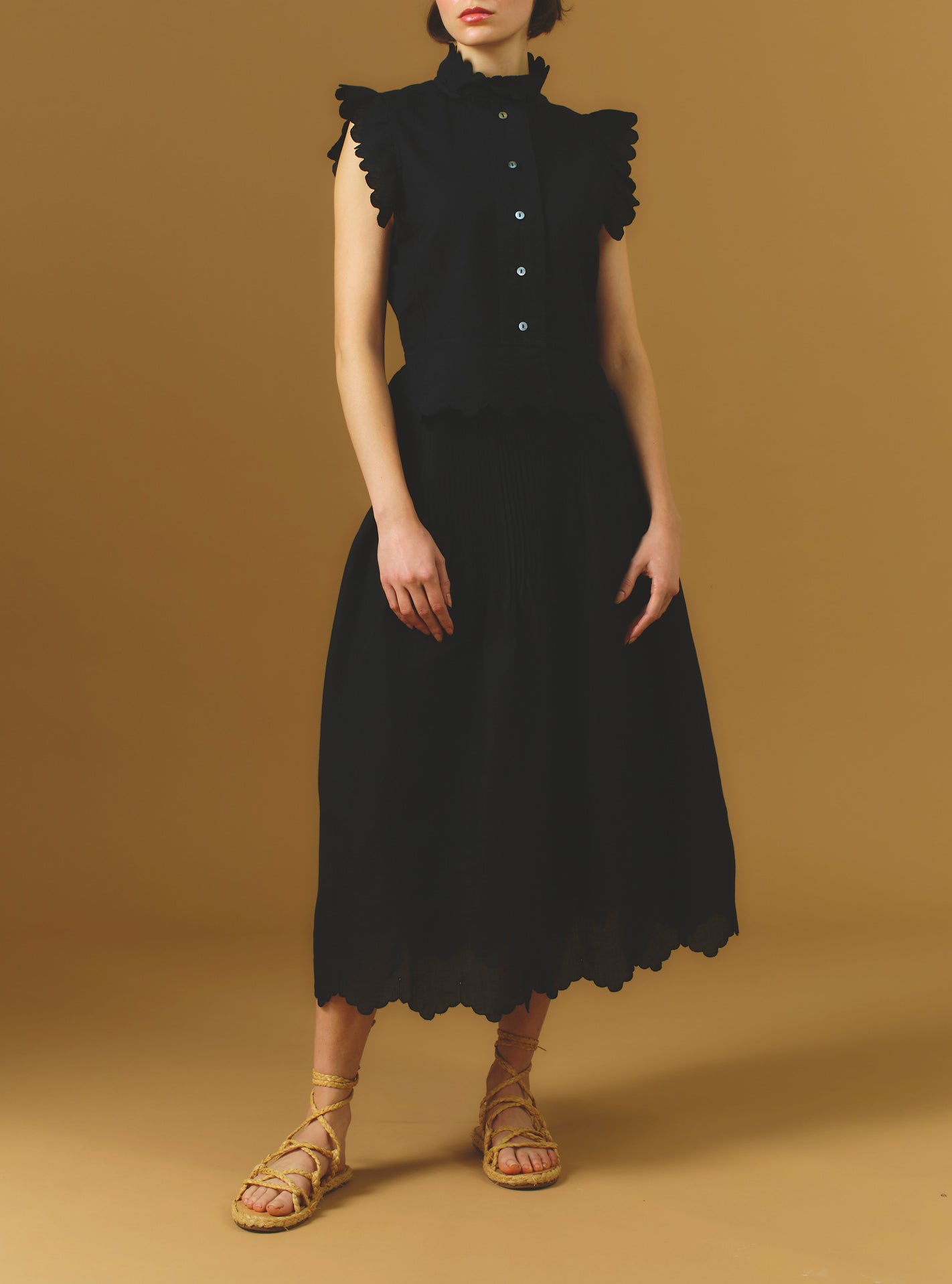 Large font view of Verde Barocco Scallops Black Skirt with Yael vest by Thierry Colson