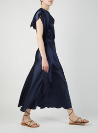 Side view of Whitney Night Blue Silk dress by Thierry Colson