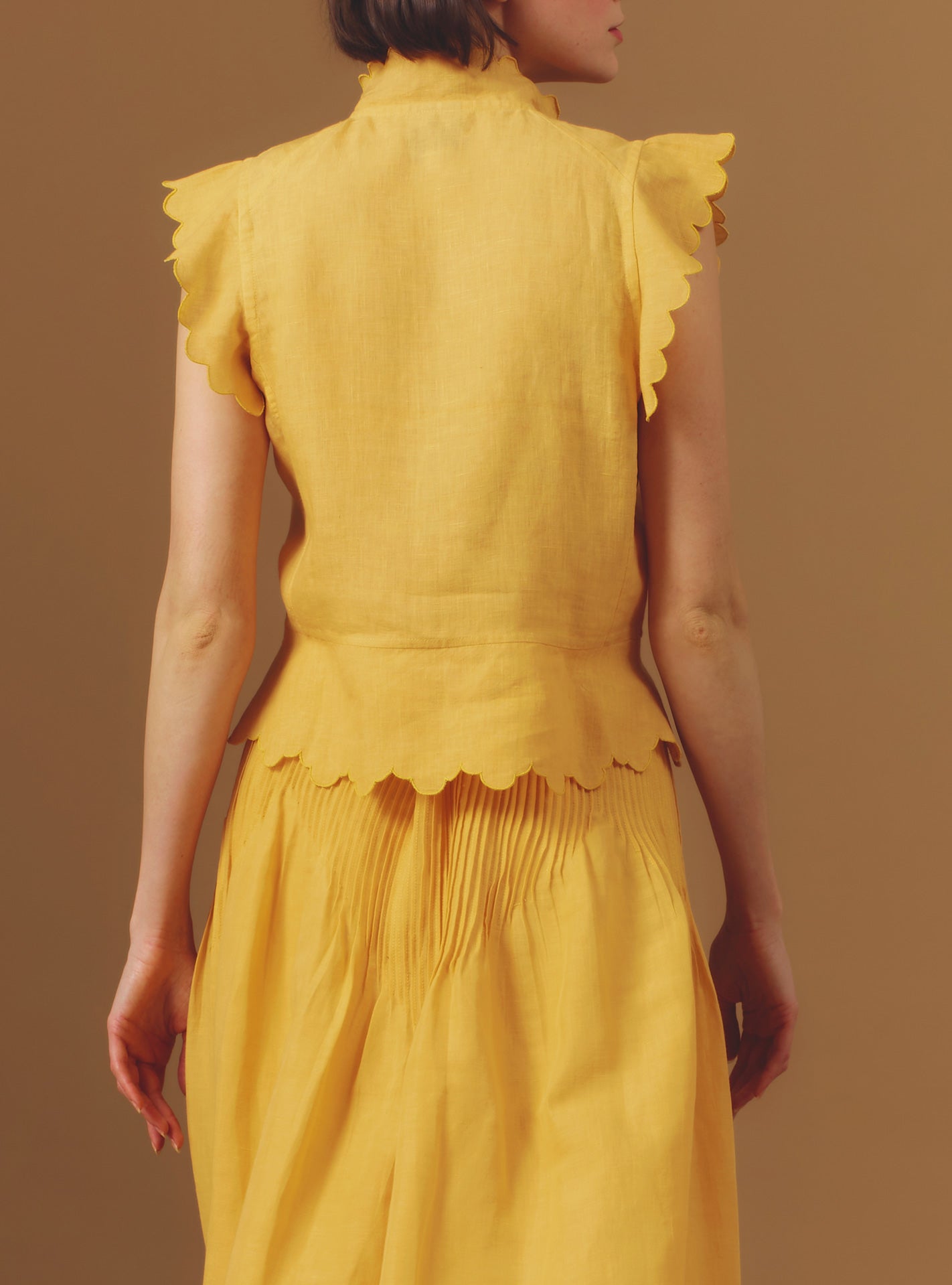 Back view of Yael Barocco Scallops Sunflower Vest by Thierry Colson